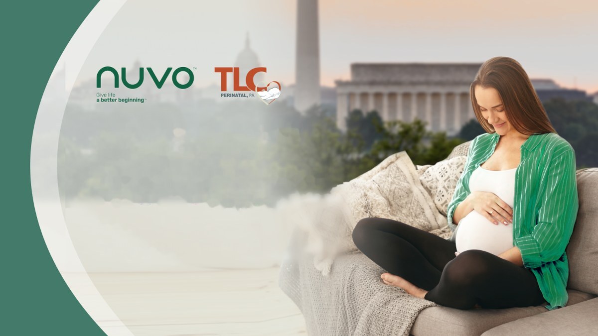 Expectant mother on a sofa with the Washington DC skyline behind, with the Nuvo and TLC Perinatal logos
